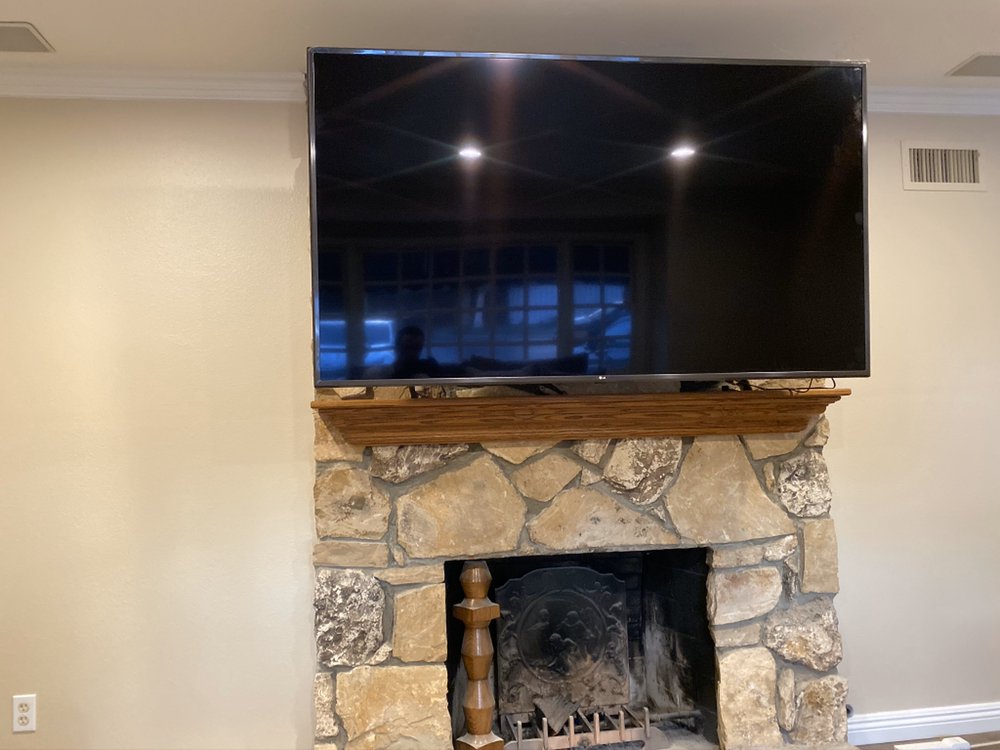 TV over stone fireplace installation